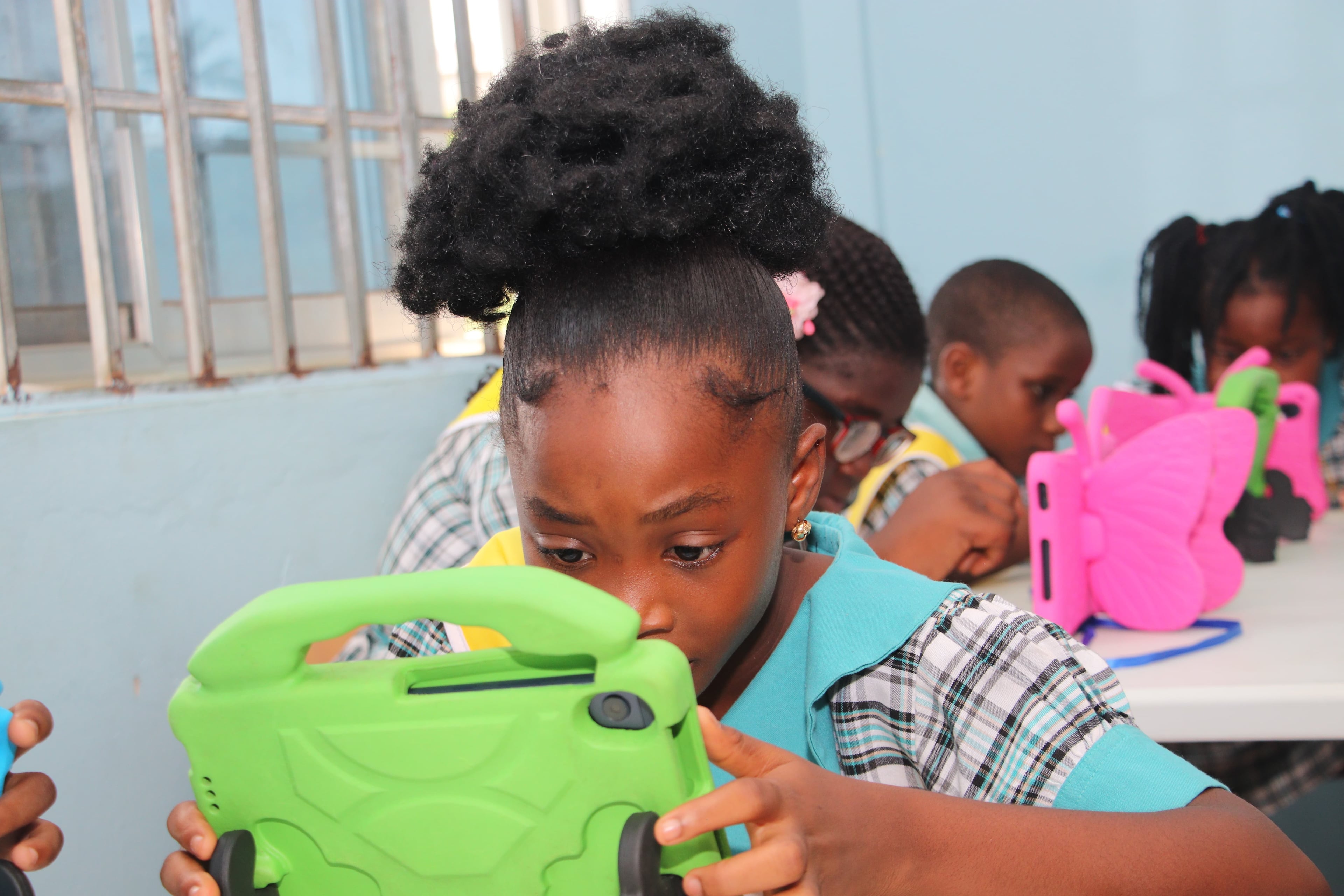 African child improving reading skills using the PerbiCubs digital reading platform